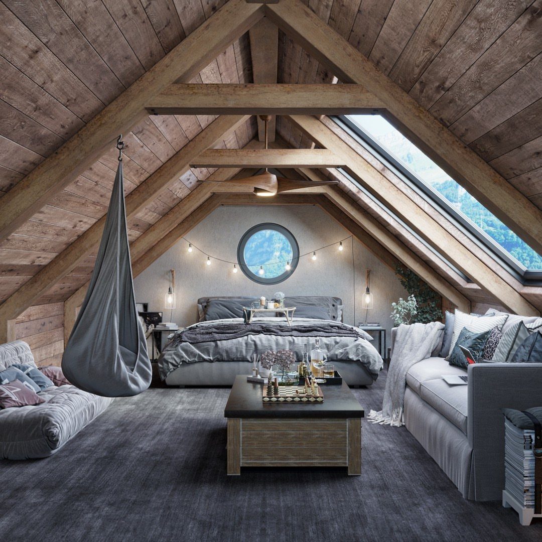 Attic bedroom with sloped wooden ceilings, grey furniture, and a hanging pod chair.