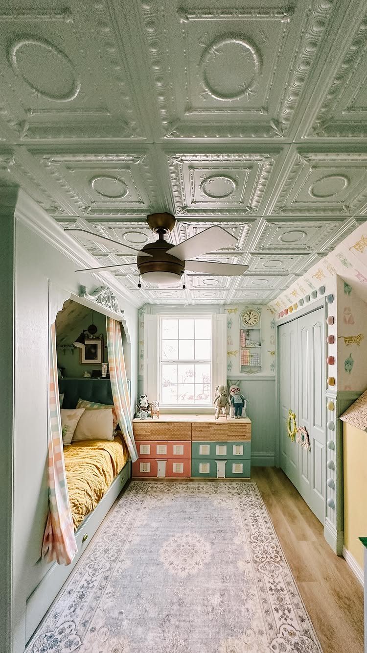 Light green embossed tin ceiling with a brown ceiling fan in a bedroom.