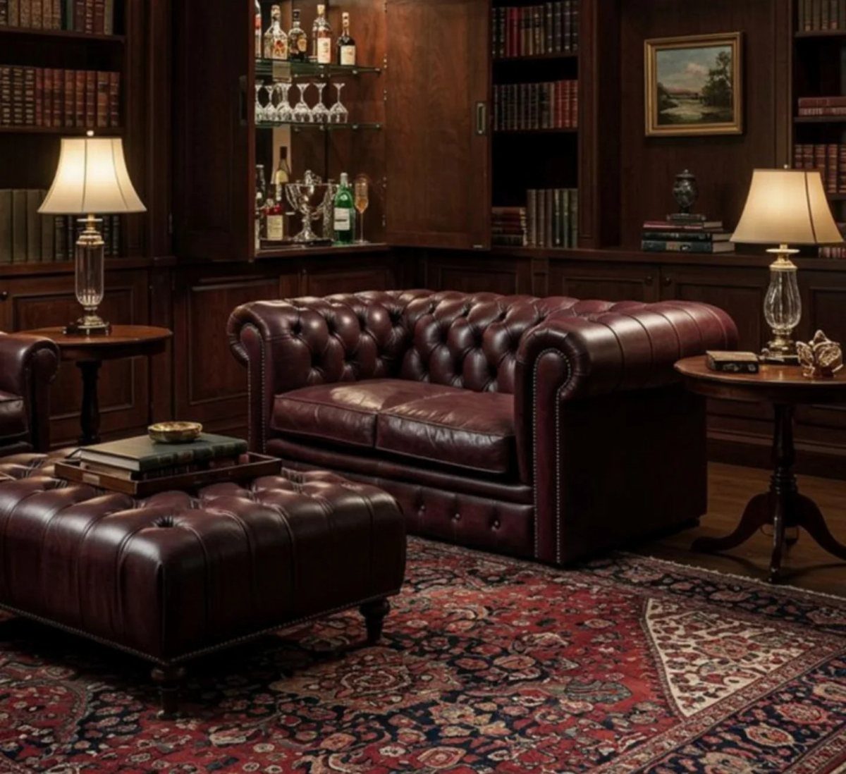 Maroon leather Chesterfield sofa and ottoman in a dark wood paneled study room