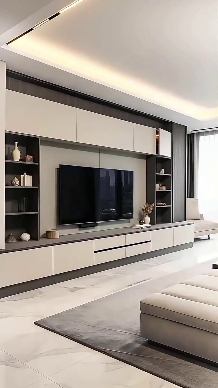 7 Family TV Room Ideas for a Comfortable Space 3 Wall-mounted TV integrated into a modern built-in media wall with sleek cabinetry.