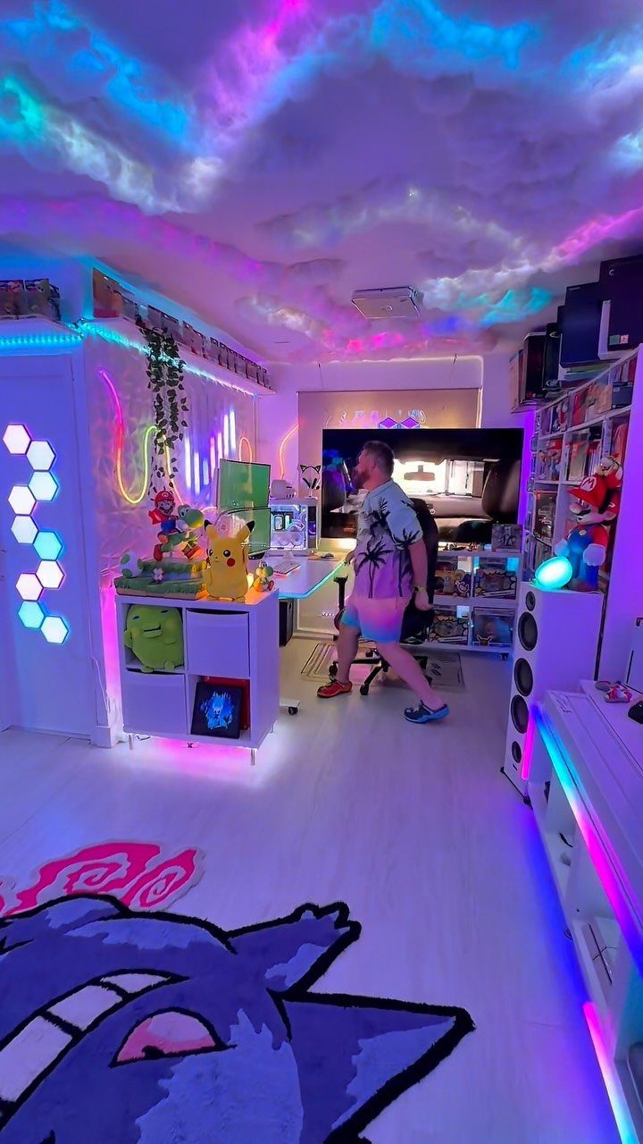 Gaming room with cloud ceiling, neon lights, Pokemon decor, and a Gengar rug.
