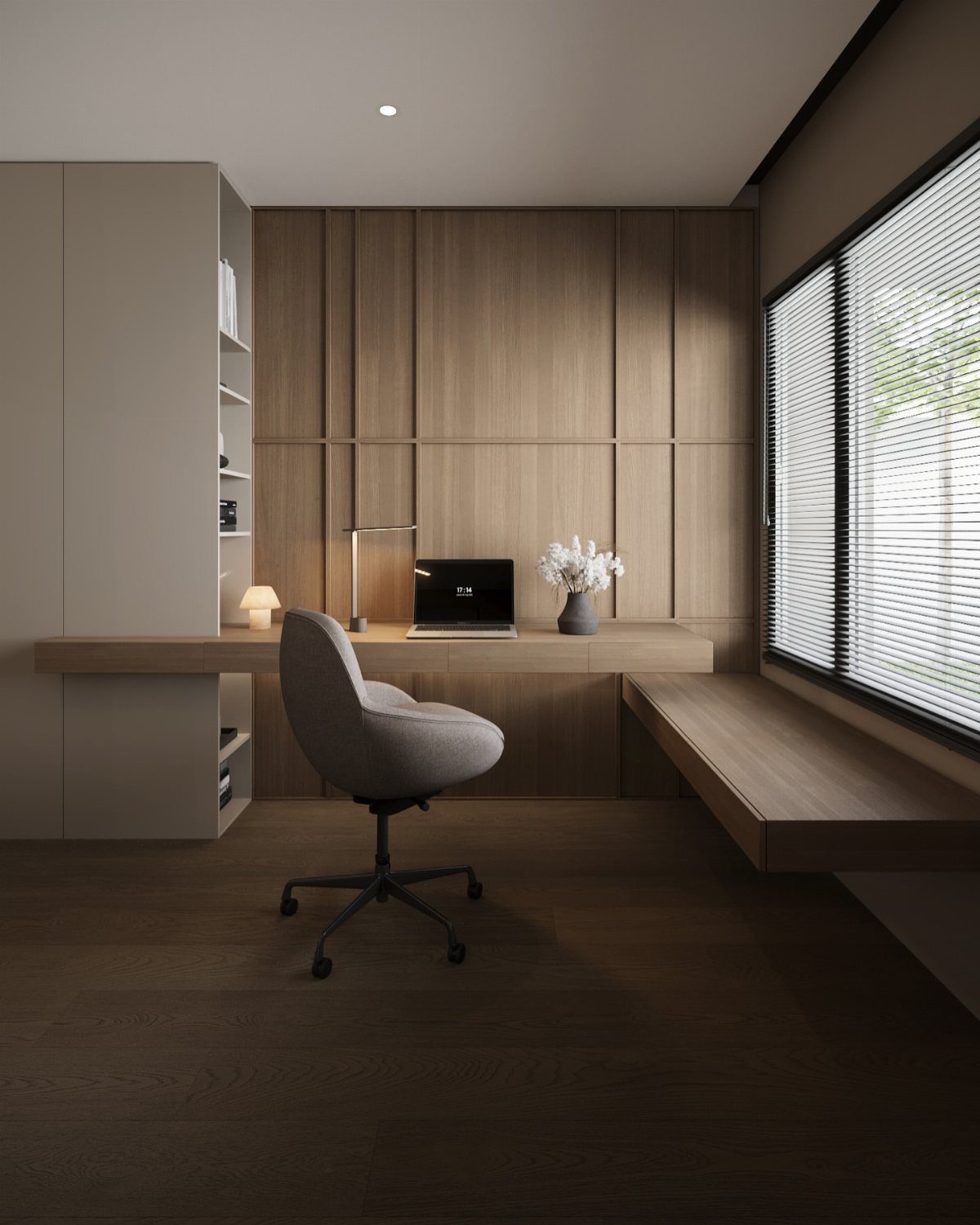 Minimalist home office with light wood desk, grey chair, and wood-paneled walls.