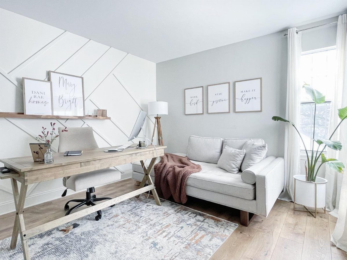 10 Home Office Paint Colors for a Productive Space 1 Home office with light gray walls, white geometric accent wall, and wooden desk.
