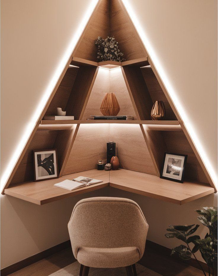 Light-wood corner desk with integrated triangular shelving and warm LED lighting in a home office.