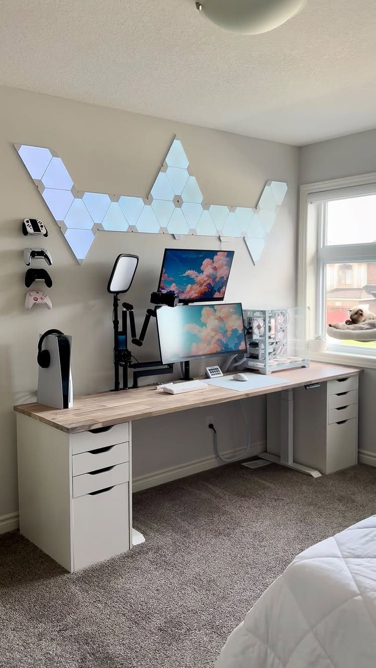 Light wood grain desktop resting on two white IKEA Alex drawer units in office.