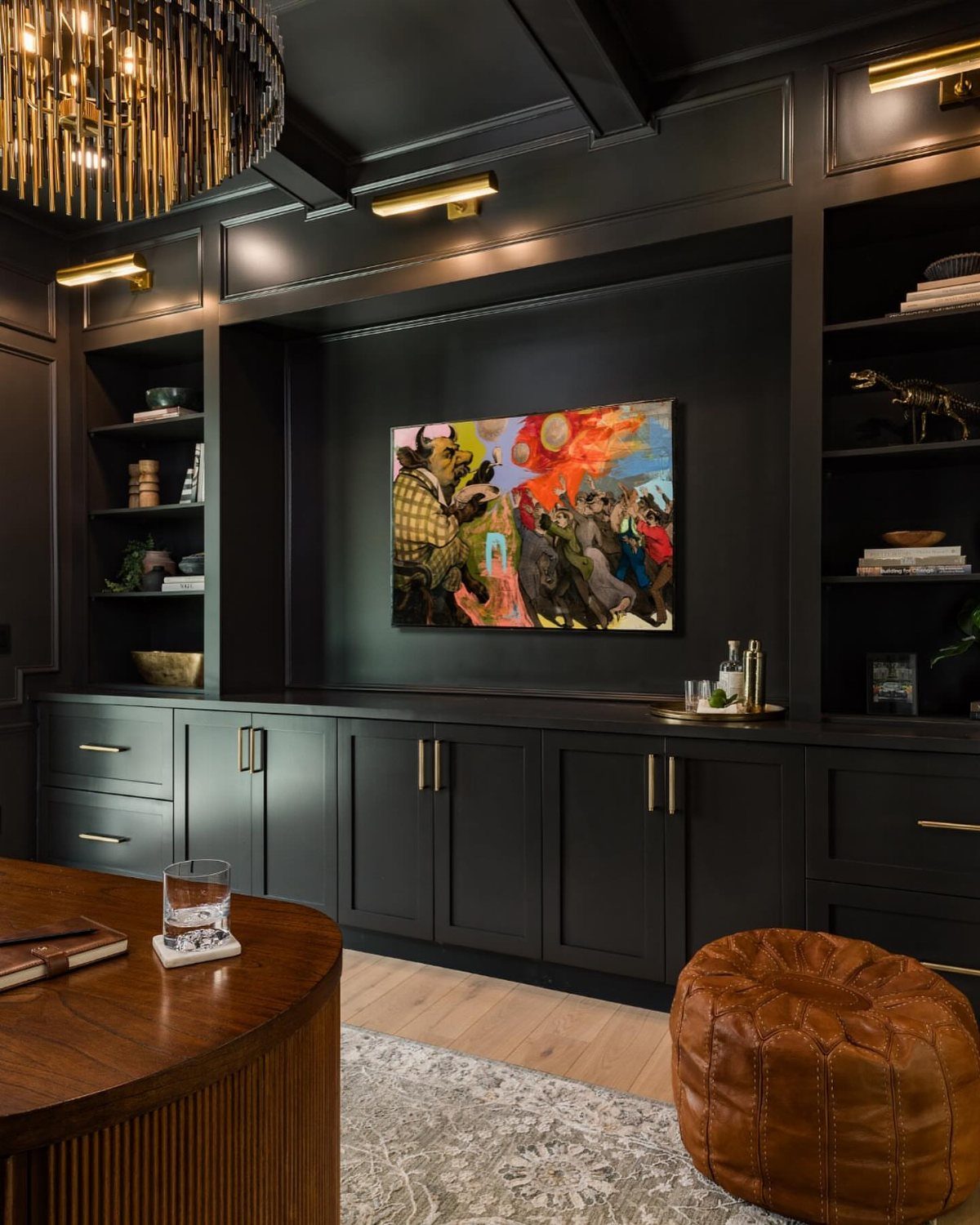 Dark grey basement remodel with low coffered ceilings and built-in black cabinetry.