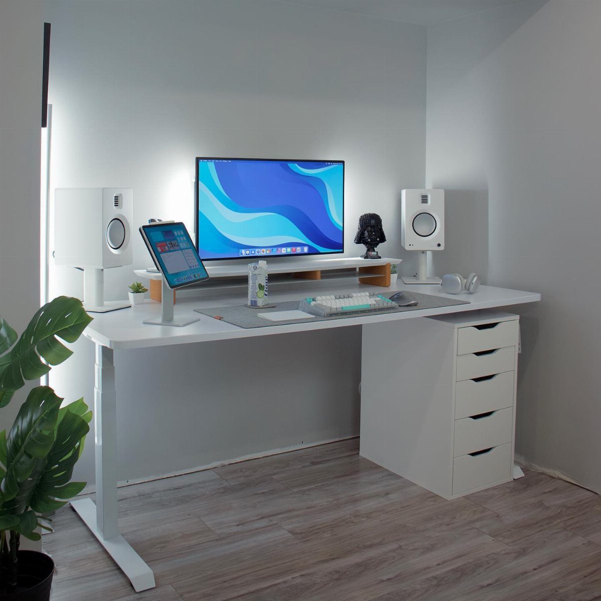 White home office desk with a computer monitor and under-desk drawer unit.