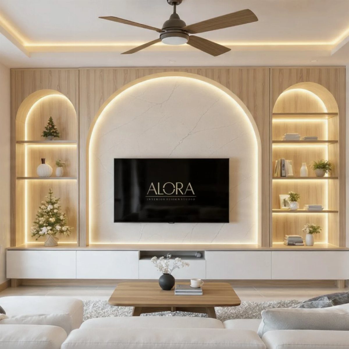 Arched recessed wall niche with warm glow lighting and a flat-screen TV.