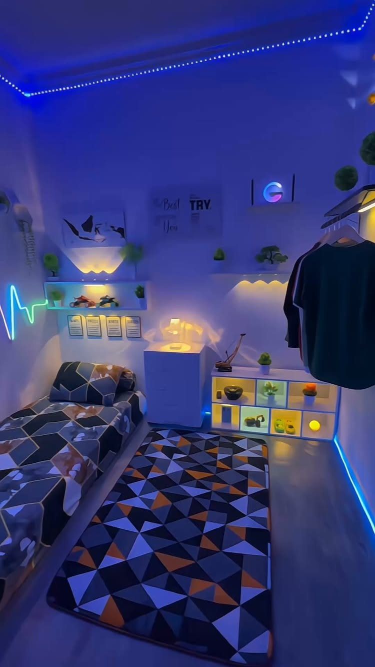Blue LED strips glowing under white floating shelves in a small gaming bedroom