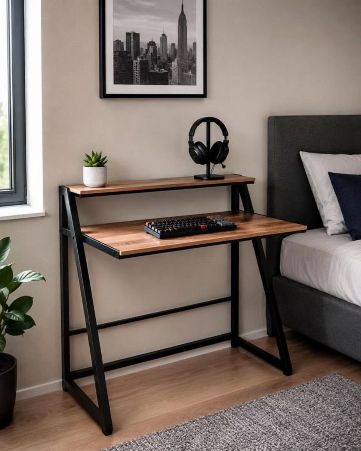 Slim wooden desk with black metal frame located in a modern bedroom.